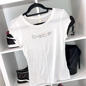BEBE white short sleeve top w/ “bebe” bling detail